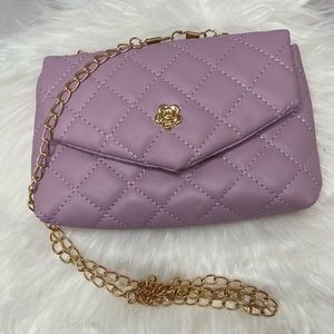 Small lavender Purse with gold chain.